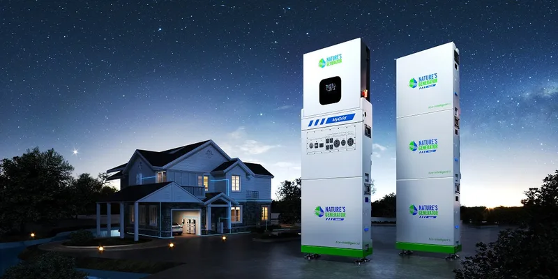 Nature's Generator Powerhouse whole-home backup system — stackable battery towers shown next to a residential house at night